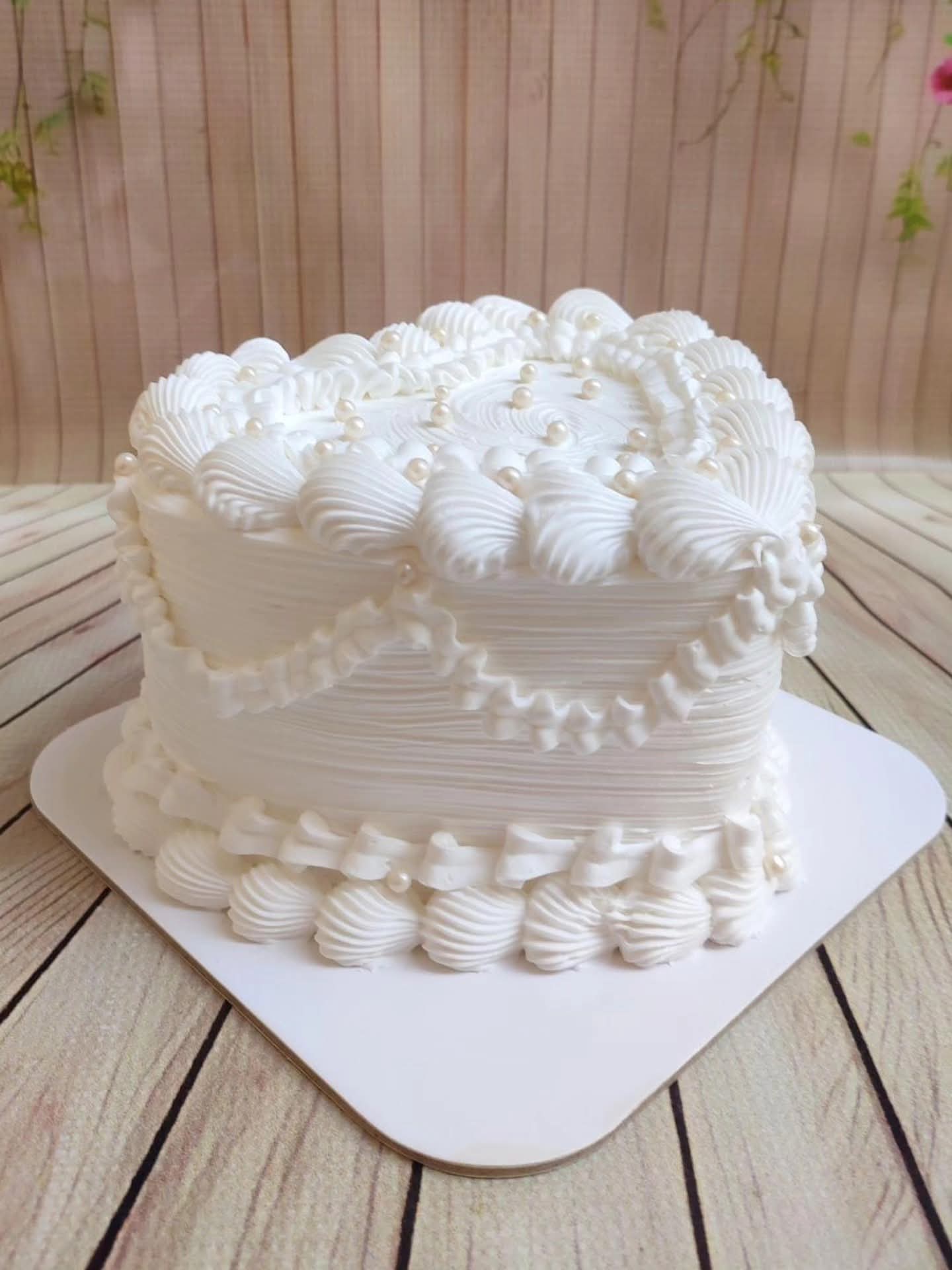 Close-up of golden drip cake with fresh berries on top